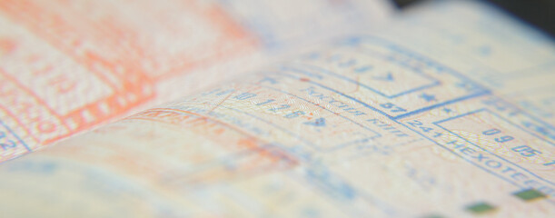 open passport pages with marks and stamps on crossing the border. High quality photo