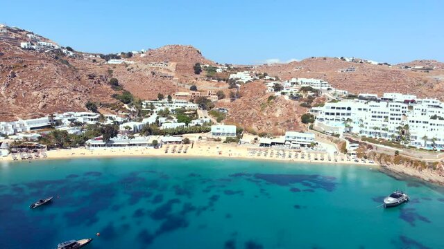 Establishing Aerial View of Famous Psarou beach Mykonos Cyclades Greece.