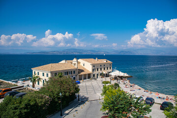 Fototapeta na wymiar Summer panoramic seascape. View of the coast of Corfu with beach. The Ionian Archipelago. Greece