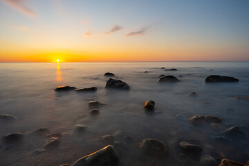 Fototapeta na wymiar Rocky shoreline sunrise at Montauk New York