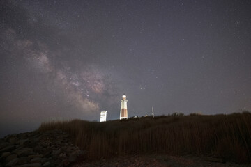 Naklejka na ściany i meble Montauk Lighthouse and the Milky Way Galaxy on a clear night