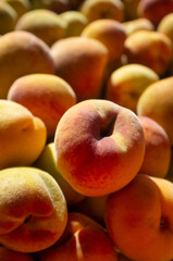 delicious ripe peaches for sale at an urban street market