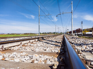 Fototapeta na wymiar Railroad tracks close-up in a sunny day