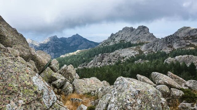 Clouds passing over the rocky granite peaks of Monte Limbara in Sardinia, Italy
