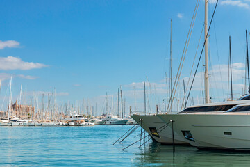 Fototapeta premium Luxury yachts docked in the seaport of the Italian city of Palma de Mallorca