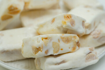 Traditional confections made with sugar or honey, roasted nuts and whipped egg whites