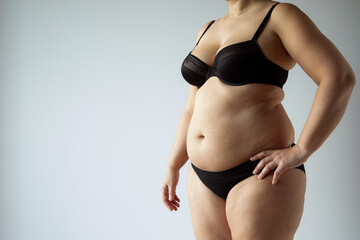 middle aged curvy woman body with belly diet concept - obrazy, fototapety, plakaty