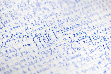 Math handwriting in notebook closeup