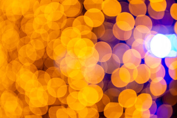 Abstract circular bokeh background of Christmaslight. bokeh from garlands. background for screensaver. Defocused lights. Blurred bokeh with yellow color lights.