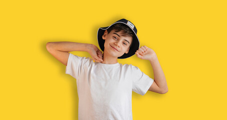 Portrait of boy stretching happily. Teenage Boy In Casual Style Outfit Isolated On Yellow Background. Back to school web banner