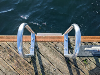 dock ladder casting harsh, dark shadows in the late afternoon at Lake Washington