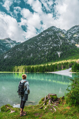 Backpacker on hiking trails in the Dolomites, Italy.