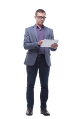 Full lenth portrait of cool businessman using electronic tablet