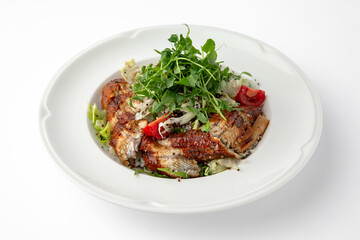Salad of smoked eel, unagi sauce and greens with vegetables. Banquet festive dishes. Gourmet restaurant menu. White background.