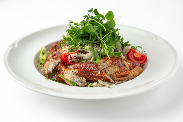 Salad of smoked eel, unagi sauce and greens with vegetables. Banquet festive dishes. Gourmet restaurant menu. White background.