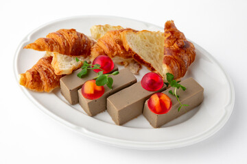 Delicate liver pate birds: duck, quail, turkey, chicken with jelly with berries and croissants for a sandwich. Banquet festive dishes. Gourmet restaurant menu. White background.