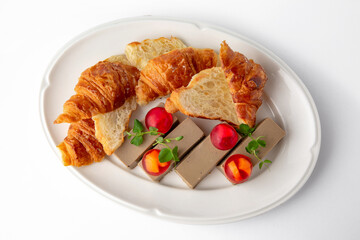 Delicate liver pate birds: duck, quail, turkey, chicken with jelly with berries and croissants for a sandwich. Banquet festive dishes. Gourmet restaurant menu. White background.