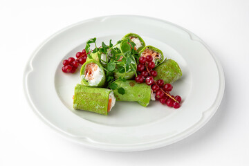 Pancakes rolls stuffed with salmon, spinach, Philadelphia cheese. Banquet festive dishes. Gourmet...
