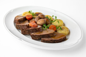 Sliced meat delicacies. Delicious beef, pork and poultry. Banquet festive dishes. Gourmet restaurant menu. White background.