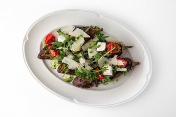 Eggplant baked with tomatoes, zucchini, parmesan. Banquet festive dishes. Gourmet restaurant menu. White background.