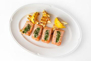 Large pieces of fillet baked with salmon cheese and sauce. Banquet festive dishes. Gourmet...