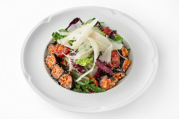 Salad with salmon, nori, vegetables and herbs. Banquet festive dishes. Gourmet restaurant menu. White background.