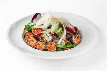 Salad with salmon, nori, vegetables and herbs. Banquet festive dishes. Gourmet restaurant menu. White background.