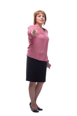 Fototapeta premium Portrait of a happy senior woman pointing upwards, isolated on a white background