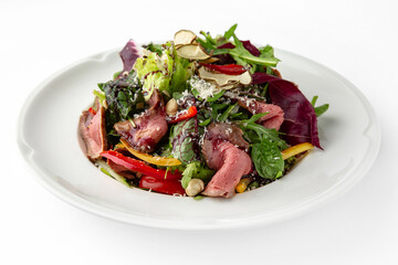 Salad with beef, vegetables and herbs. Banquet festive dishes. Gourmet restaurant menu. White...
