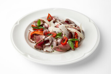 Salad with beef, cheese, vegetables and herbs. Banquet festive dishes. Gourmet restaurant menu. White background.