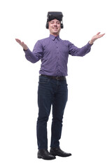 Young man wearing a VR glasses smiling and raising his hand pointing up
