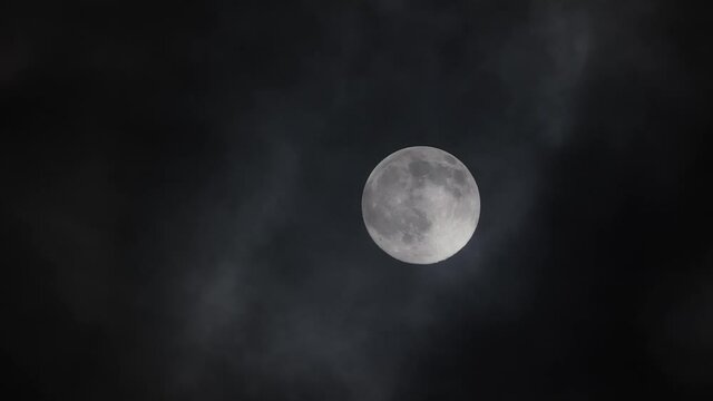 Moon and dark clouds at night