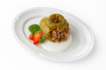 Sweet peppers stuffed with rice, vegetables and meat, baked in the oven. Banquet festive dishes. Gourmet restaurant menu. White background. 