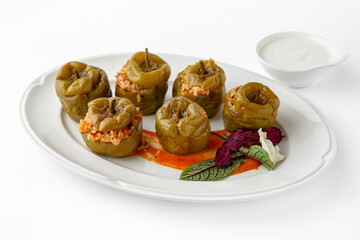 Sweet peppers stuffed with rice, vegetables and meat, baked in the oven. Banquet festive dishes. Gourmet restaurant menu. White background. 