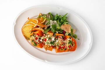 Vegetarian dish, baked carrots baked with bulgur and vegetables. Banquet festive dishes. Gourmet...