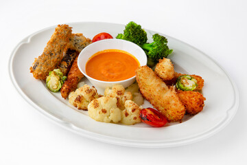 Fish fillets, chicken in batter with vegetables. Banquet festive dishes. Gourmet restaurant menu....