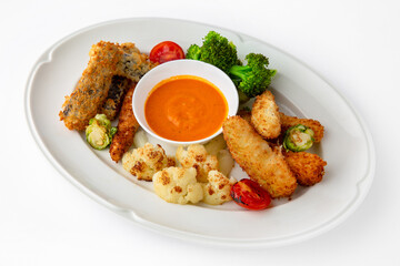 Fish fillets, chicken in batter with vegetables. Banquet festive dishes. Gourmet restaurant menu....