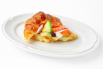 Mini sandwich with salmon, avocado, truffle oil. Beautifully decorated catering banquet menu. Food snacks and appetizers for buffet. Isolated on white background