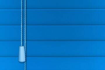 Horizontal venetian blinds in blue with pull cord in close up