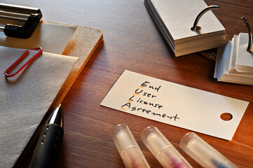The words End User License Agreement written in a word card with colored pens. Close-up.