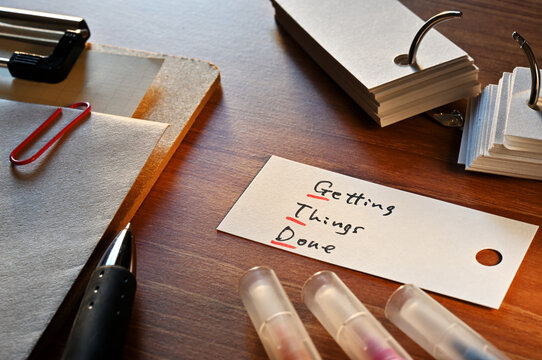 The words Getting Things Done written in a word card with colored pens. Close-up.