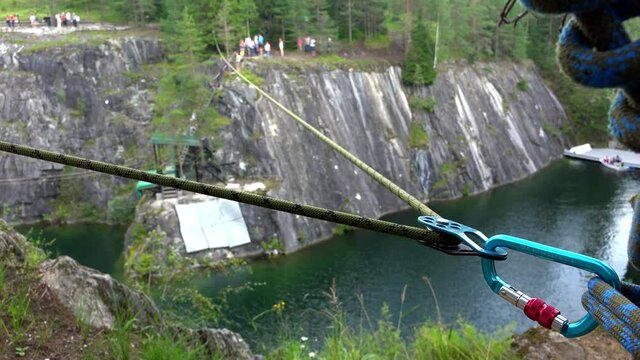 A safety rope over a mountain precipice. 4K.