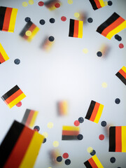 German Unity Day. October 3. National flags on a foggy background. The concept of patriotism, memory, and freedom