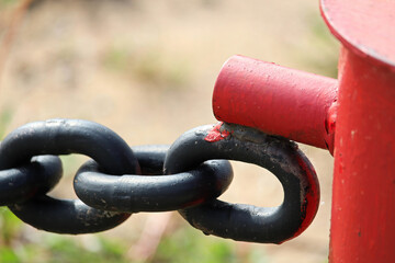 The welded clasp end where a chain link fence connects