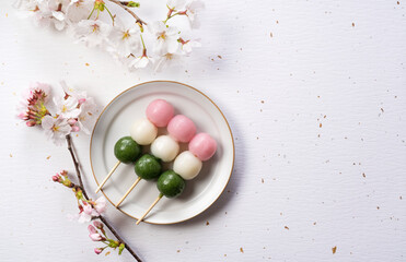 Tricolor dumplings placed on a white background
