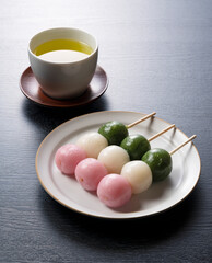 Sanshoku dango and green tea. An image of Japanese spring