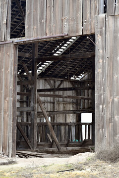 Vertical shot of an interior of an old barn in the farm