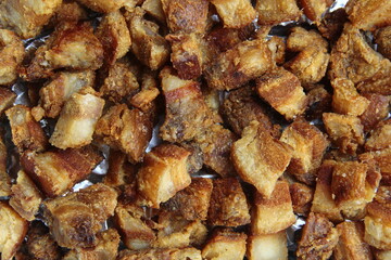 Freshly cooked Filipino food called Lechon Kawali or pan fried chopped crispy pork belly