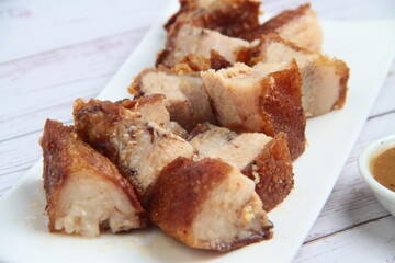 Freshly cooked Filipino food called Lechon Kawali or pan fried chopped crispy pork belly