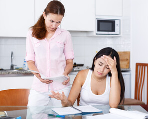 Teen girl learns badly, so her mother is unhappy, scene takes place in kitchen